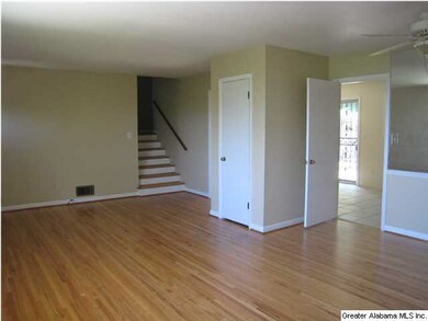 Living Room/Dining Room shows stairs to bedroom ar