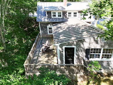 Deck overlooking nature with sunset views.