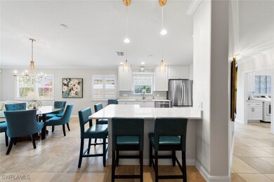 Kitchen with stainless steel appliances, light cou