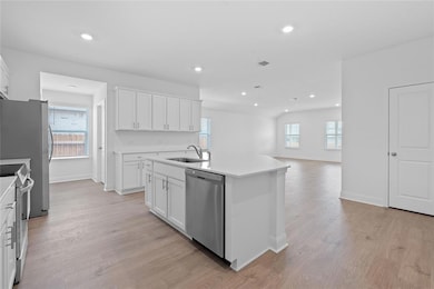 Kitchen featuring appliances with stainless steel