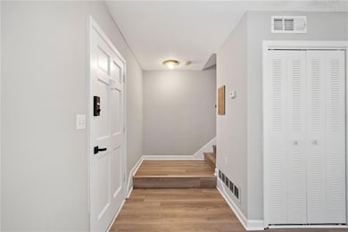 Entrance foyer and stairs leading to the second floor.