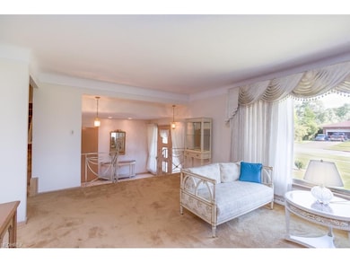 The spacious living room is light filled and boast
