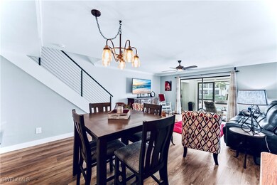 Dining space featuring ceiling fan with notable ch