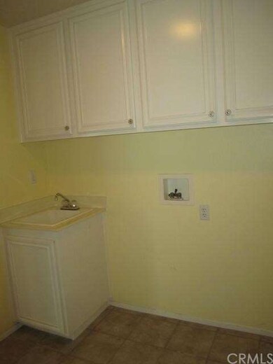 Large interior laundry with utility sink