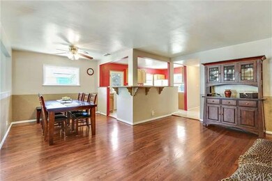 Living Room View to Dining Room & Kitchen