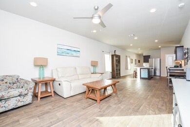 Great spacing and flowing vinyl wood-like flooring throughout this lovely home.