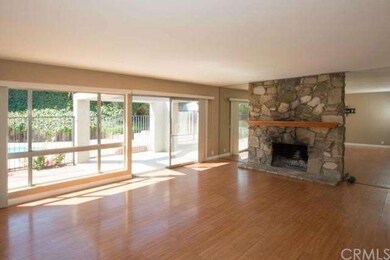 Living Room with Fireplace and Floor-to-ceiling Mi