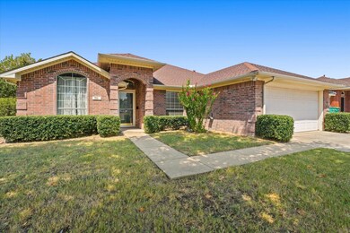 Ranch-style home with a garage and a front yard