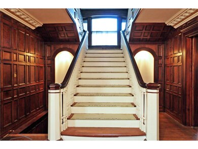 Grand staircase that continues to the third floor.