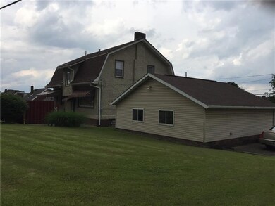 Rear of home, garage and backyard