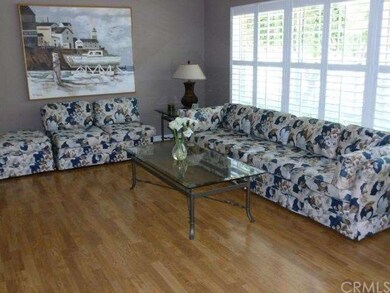 Bright formal living room with plantation shutters