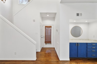 This stunning townhome boasts soaring ceilings, ha