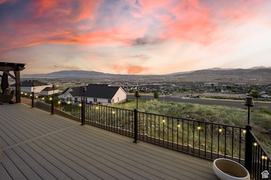Deck with a mountain view and a residential view