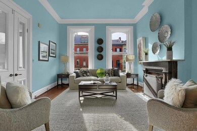 A spacious living room with glass paneled double d