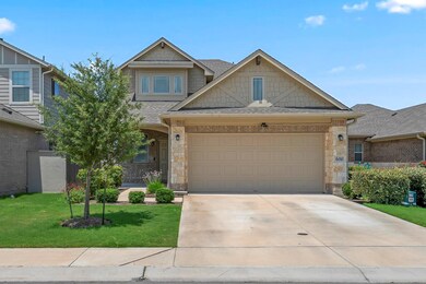 View of front facade featuring driveway, a front 
