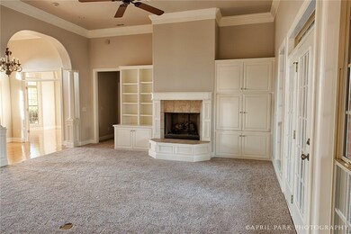 Large living room with built in cabinetry around g
