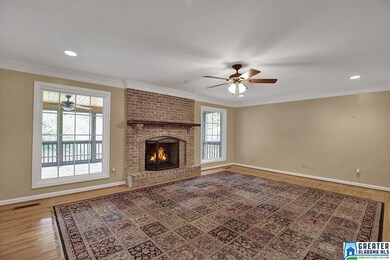 This room has hardwoods and a gas starter fireplac