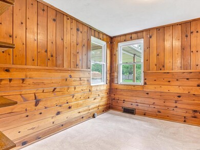 Beautiful knotty pine wood lined walls and more shelving for your convenience.
