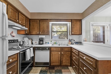 Kitchen featuring dishwasher, refrigerator, electr