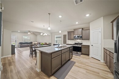 Kitchen with a sink, stainless steel appliances, l