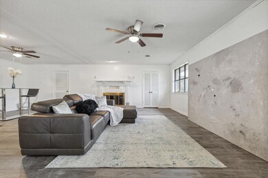 Living room featuring a textured ceiling, ceiling 