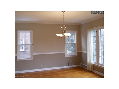 Formal Dining Room with hardwood floors, chair rai