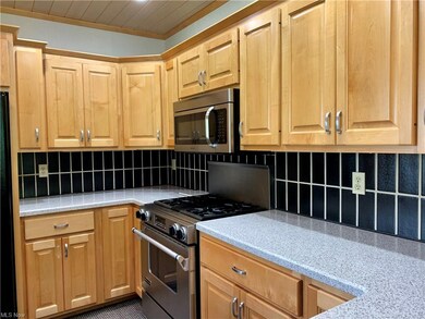 Lovely Corian counter tops, tile backsplash, solid