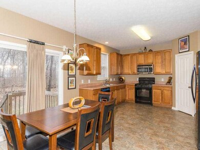 Breakfast Area/Room. Cozy and private gathering place with windows overlooking the woods behind the house.