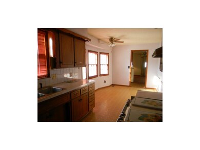 Nice galley kitchen with a gas stove.