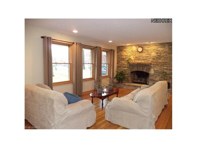 Living Room with Hardwood Floors, gas log stone fi
