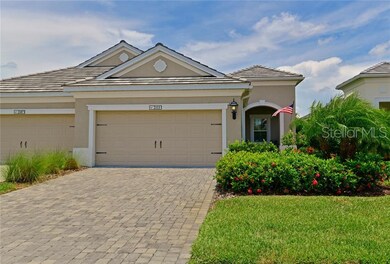 Brick pavers and tile roof enhance the curb appeal