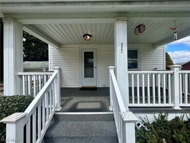 View of exterior entry featuring covered porch