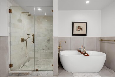 Full bath with tile walls, recessed lighting, a s