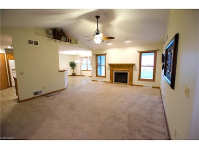 Another view of the living room, dining area and p
