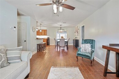 Living room and view to dining area.