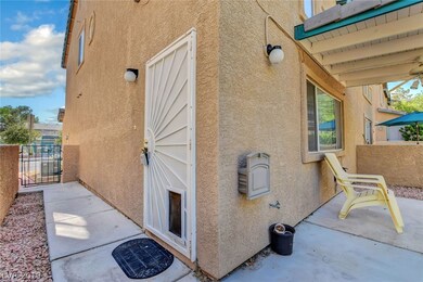Side entry with doggy door and covered patio