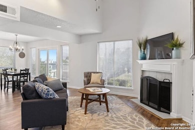 Living room with plenty of natural light, a chand