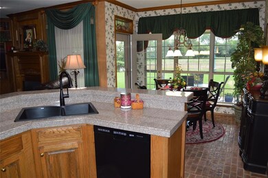 Kitchen with sink, crown molding, and dishwasher