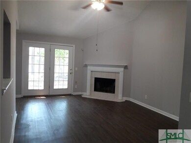 great room with fireplace and vaulted ceilings
