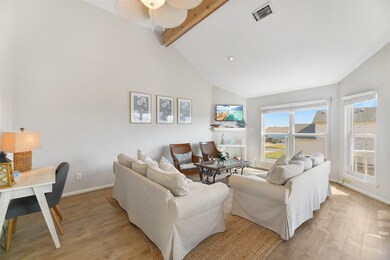 The living room. Notice luxury vinyl plank floorin