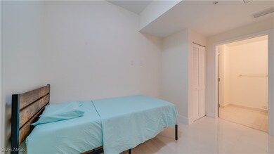 Tiled Den featuring a half bathroom