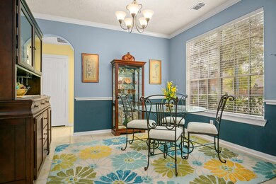 Enjoy dinner guests in this elegant formal dining RM featuring crown molding, chair rail and views overlooking the front lawn.