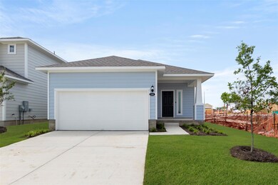 View of front of home featuring concrete driveway