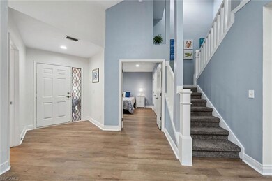 Entrance foyer featuring wood-type flooring