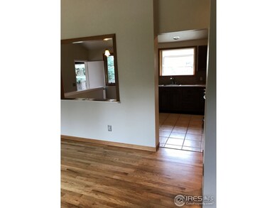 Living room looking into kitchen