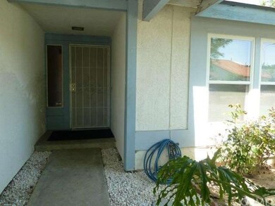 MAIN ENTRY WITH SECURITY DOOR LEADING TO THE MAIN 