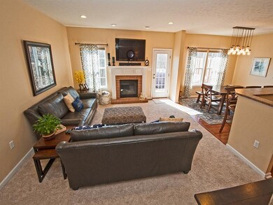 ANOTHER VIEW OF THE FAMILY ROOM OPEN TO THE DINING