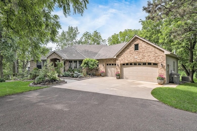 Located on a quiet cul-de-sac, this elegant 4 bedroom, 4 bath rambler offers a spacious 3-car garage, expansive driveway, and beautifully maintained grounds surrounded by towering trees for added privacy.