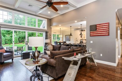 Living room with 12 foot coffered ceilings