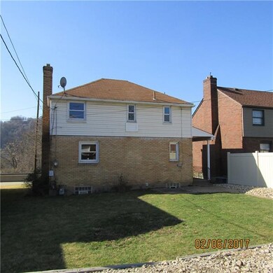 Rear yard with parking pad.